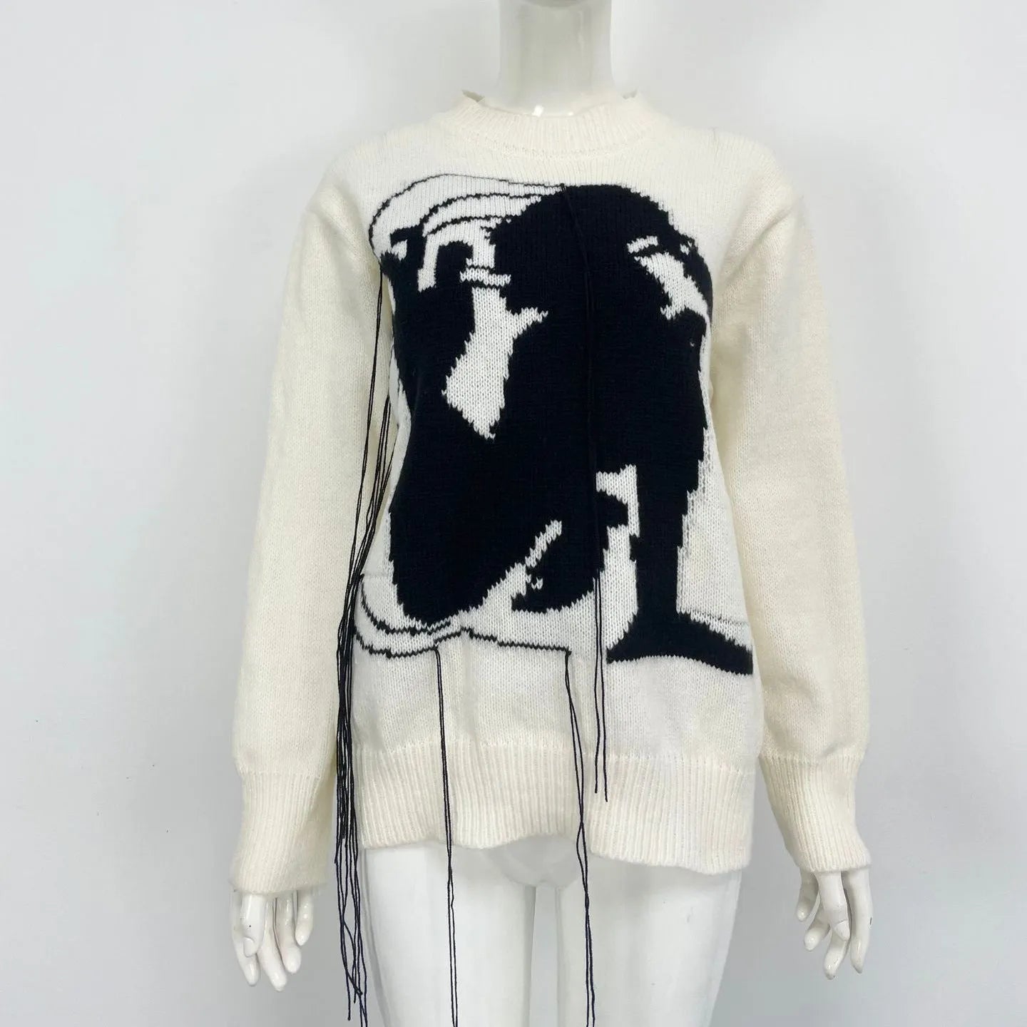 Women's grey alpaca wool pullover sweater with tassel detailing and abstract pattern