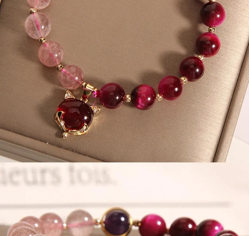 Simple strawberry crystal bracelet for women with elastic band, showing natural stone detail.