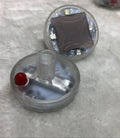 Colourful solar-powered LED decorative light for mounting on a vehicle wheel hub