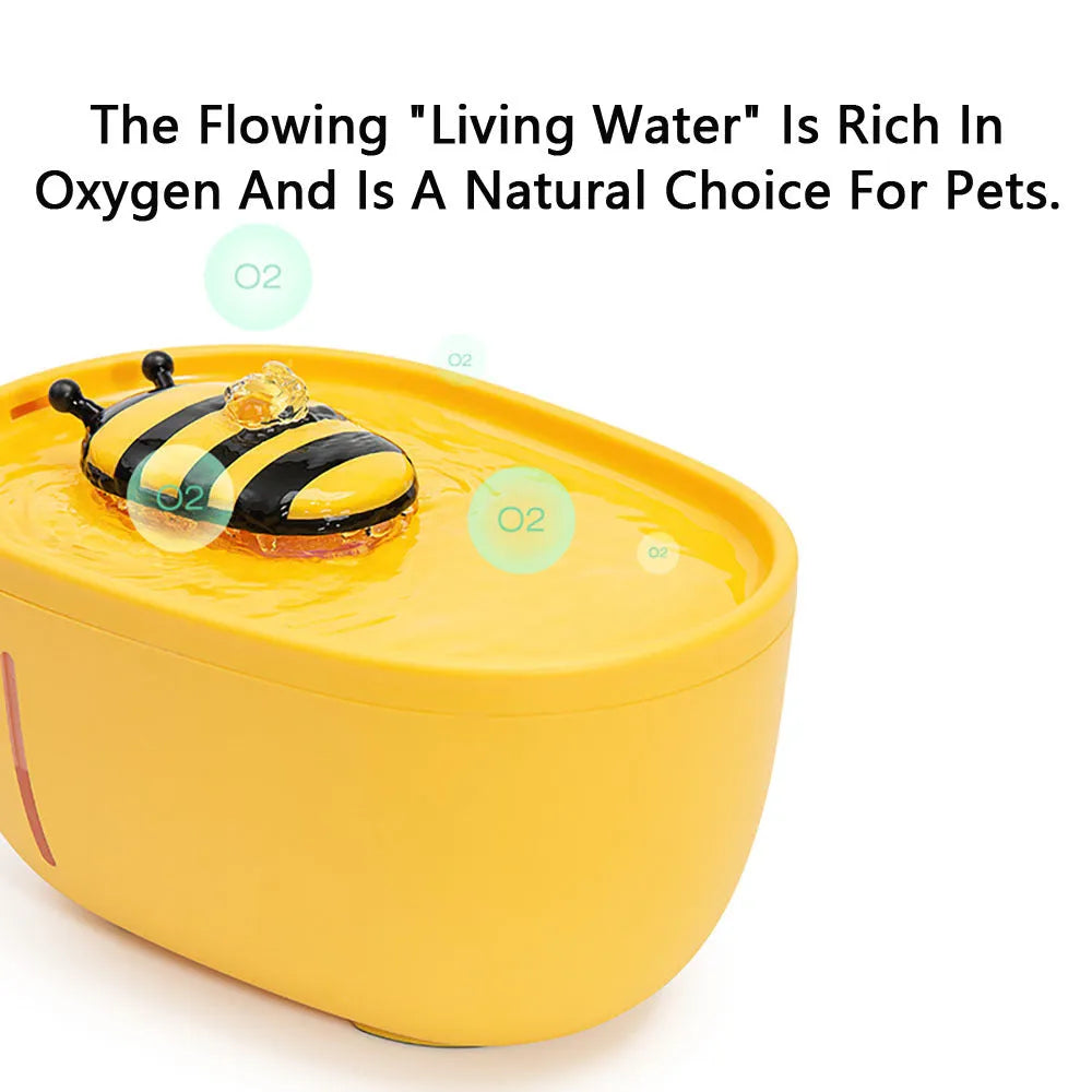 Yellow automatic cat water fountain with filter and silent USB pump on anti-slip base.