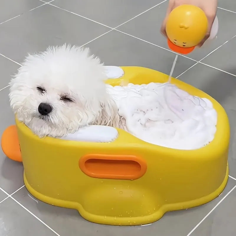 Blue PVC bathtub shaped like a duck for washing dogs and cats, shown on a patio.