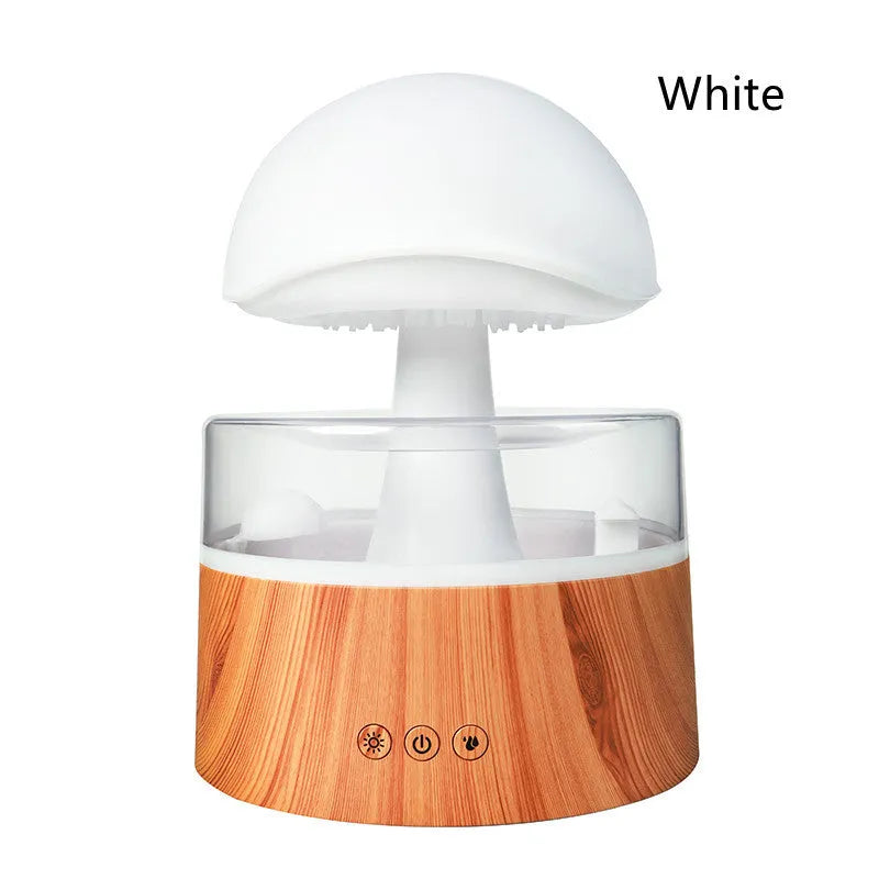 White cloud-shaped humidifier emitting mist with LED lights and falling water droplets