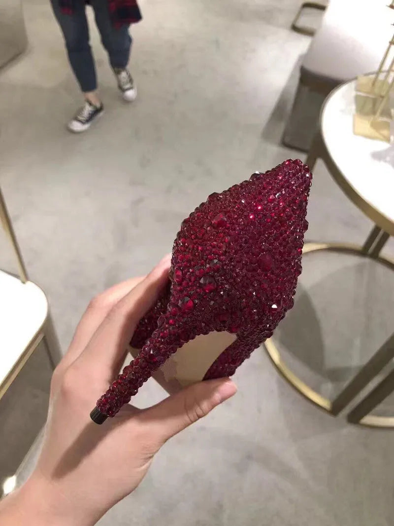 Women's gold pointed toe stiletto heels with sequin cloth upper and rhinestone decoration