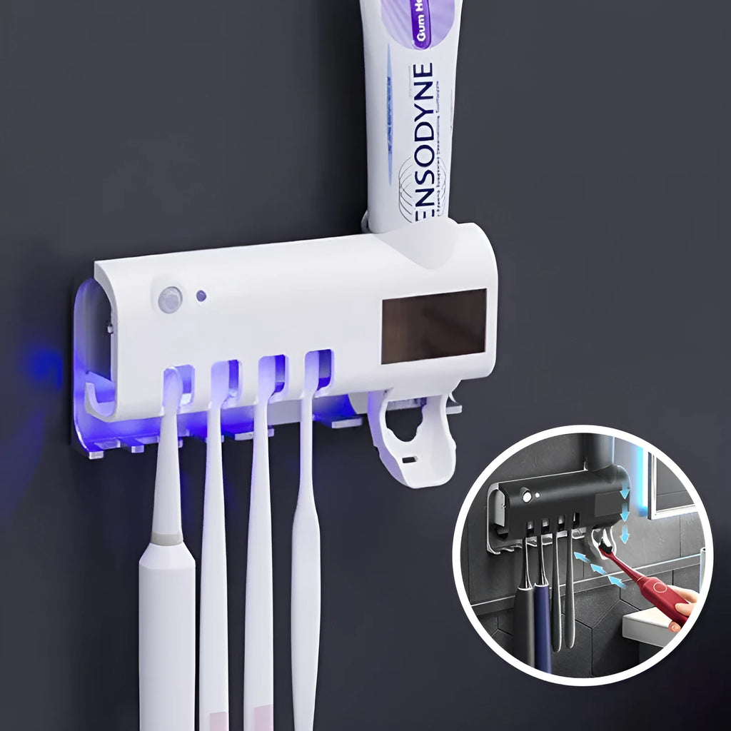 White automatic toothpaste squeezer and toothbrush steriliser unit mounted on bathroom wall