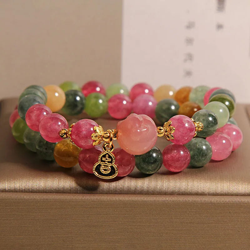 Natural jade colour tourmaline crystal double ring bracelet for women with Buddha head charm on white background