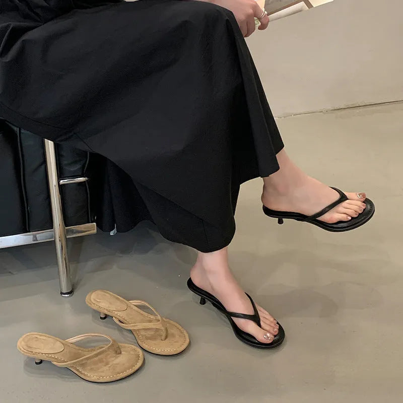 Women's stiletto flip-flop sandals in black or camel with round toe and open-toe design