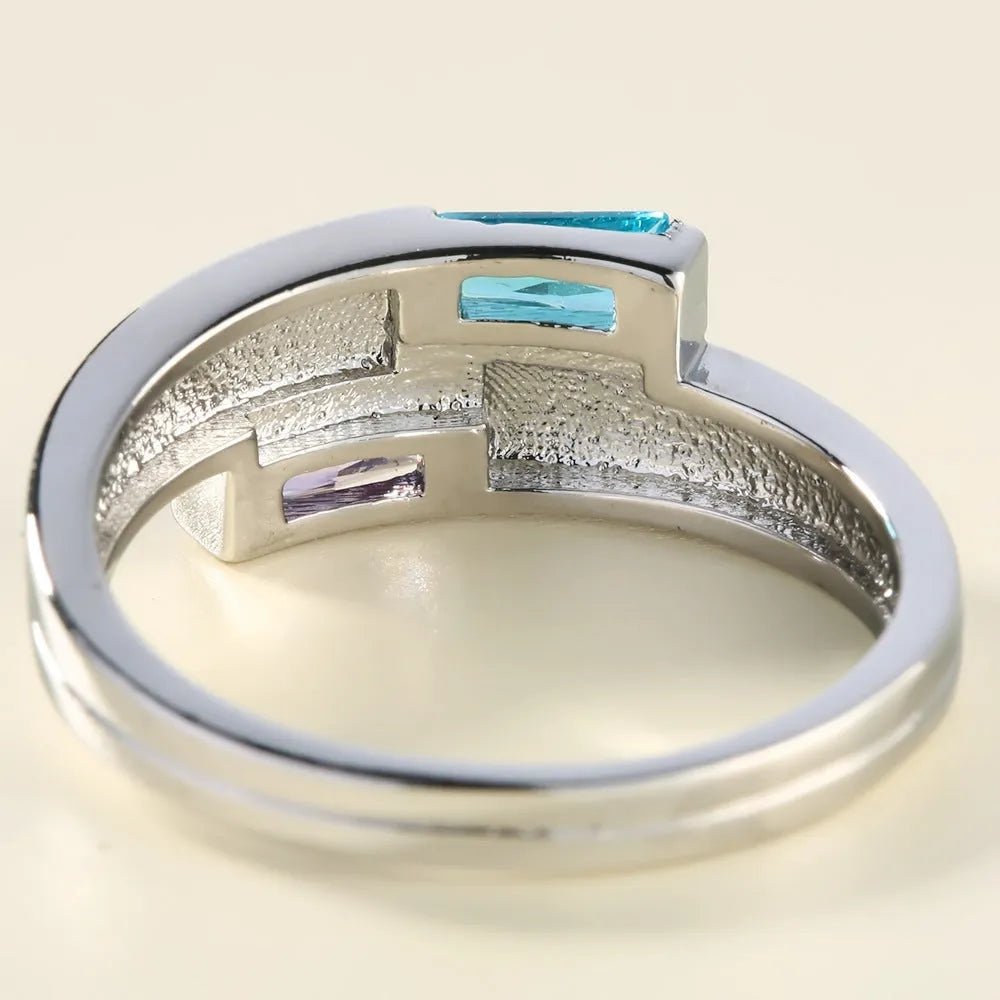 Silver copper ring with zircon inlay showing electroplated finish and contemporary band design