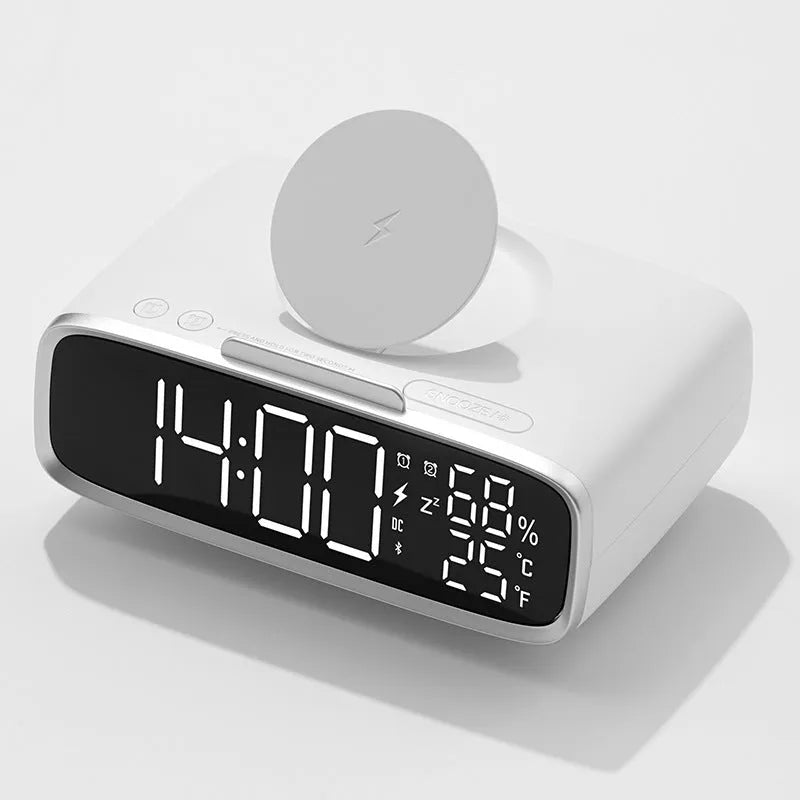 White Bluetooth speaker wireless charger with night light functionality on bedside table