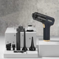 Black wireless car vacuum cleaner with multiple nozzle attachments including brushes and suction nozzles