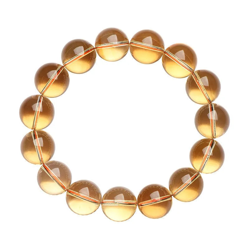 Natural citrine scattered beads bracelet showing polished gemstones in an original design on a wrist.