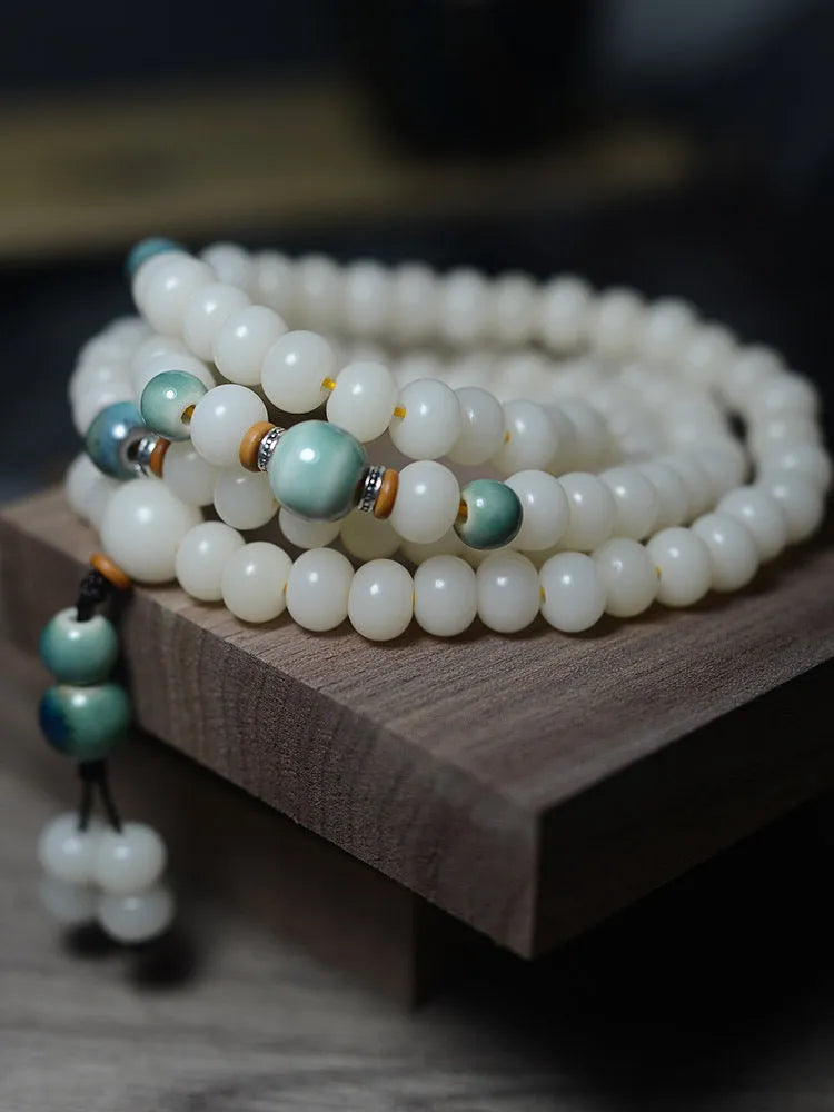 White bodhi seed bracelet with 108 flat round beads in two sizes