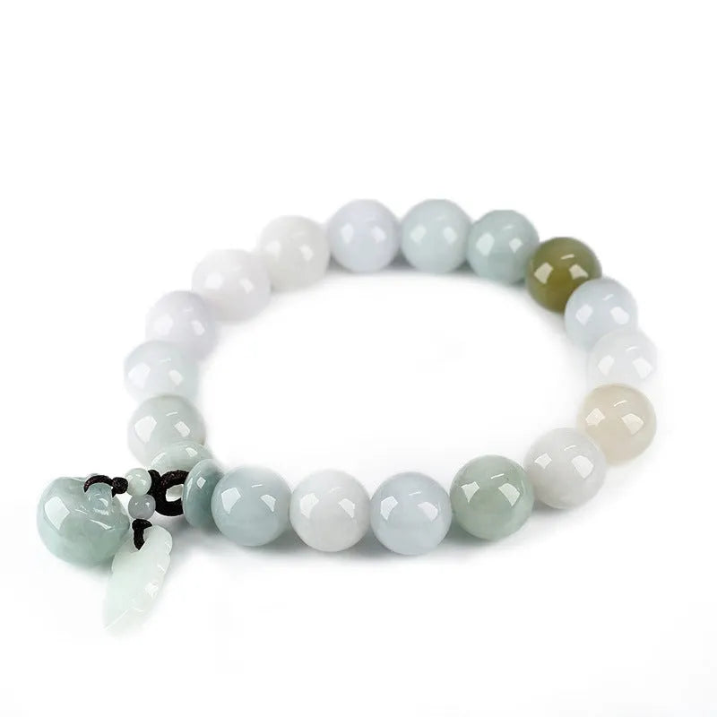 Apple green jade bracelet with carved Maitreya Buddha, gourd, and money bag beads.