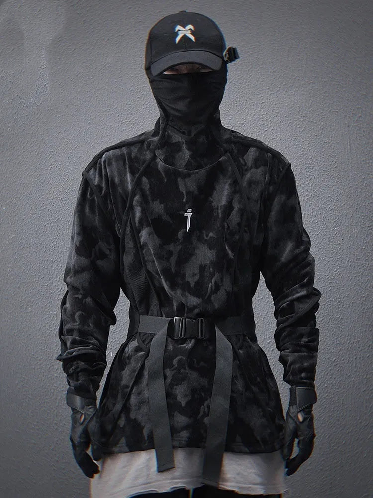 Men's black tie dye patterned pullover sweater with turtleneck and drop shoulders on a grey background.