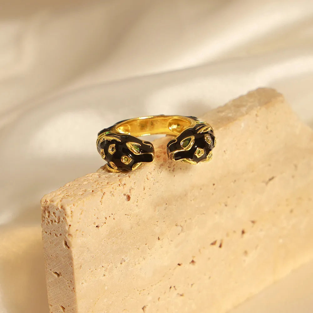 Geometric open ring for women with a black cheetah print pattern, size 7.