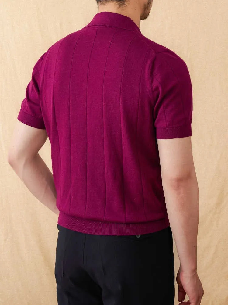 Purple short sleeve polo shirt with a seagull collar and a sunken stripe knitted pattern.