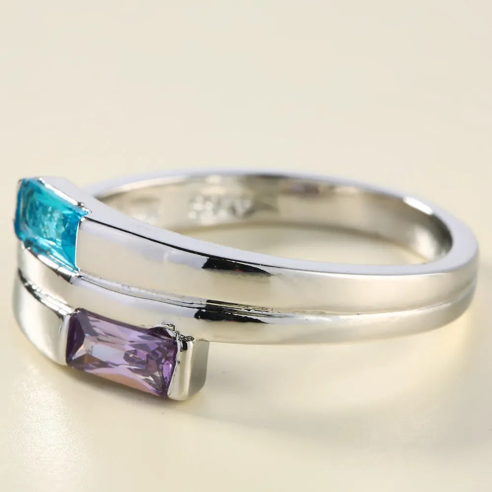 Silver copper ring with zircon inlay showing electroplated finish and contemporary band design