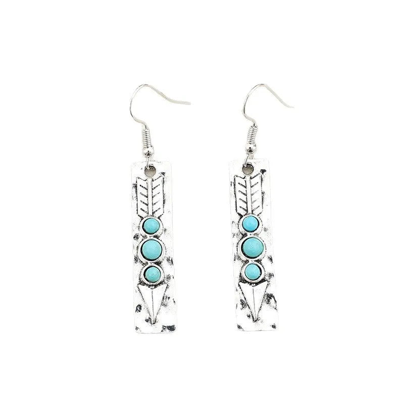 Long silver geometric earrings with turquoise inlay details on zinc alloy