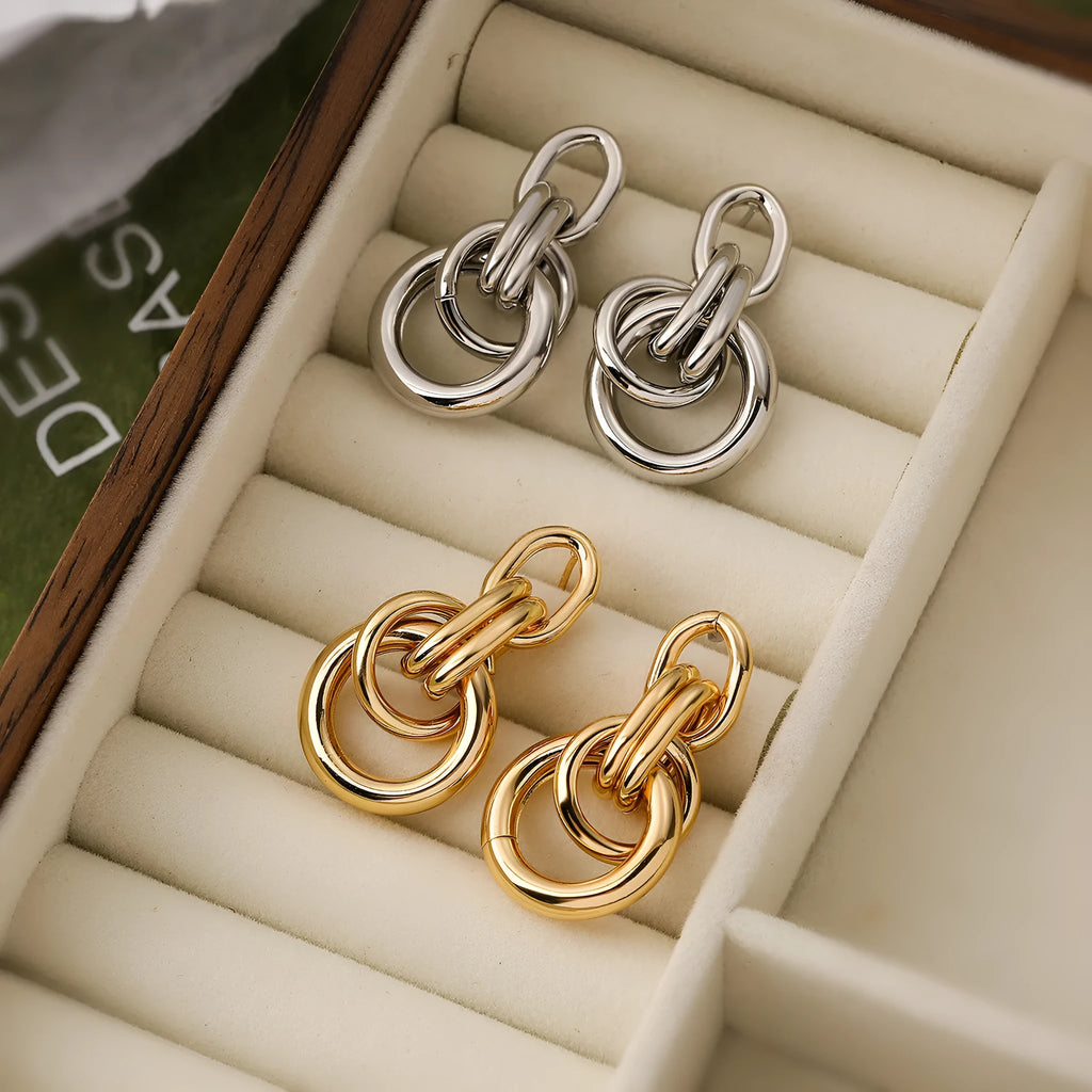 Geometric copper earrings for women in gold with irregular high-profile shape