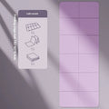 Purple TPE folding gymnastic mat, shown open and folded, on a wooden floor.
