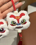 Blue Chinese style plush lion keychain ornament with tassels and star stone detail