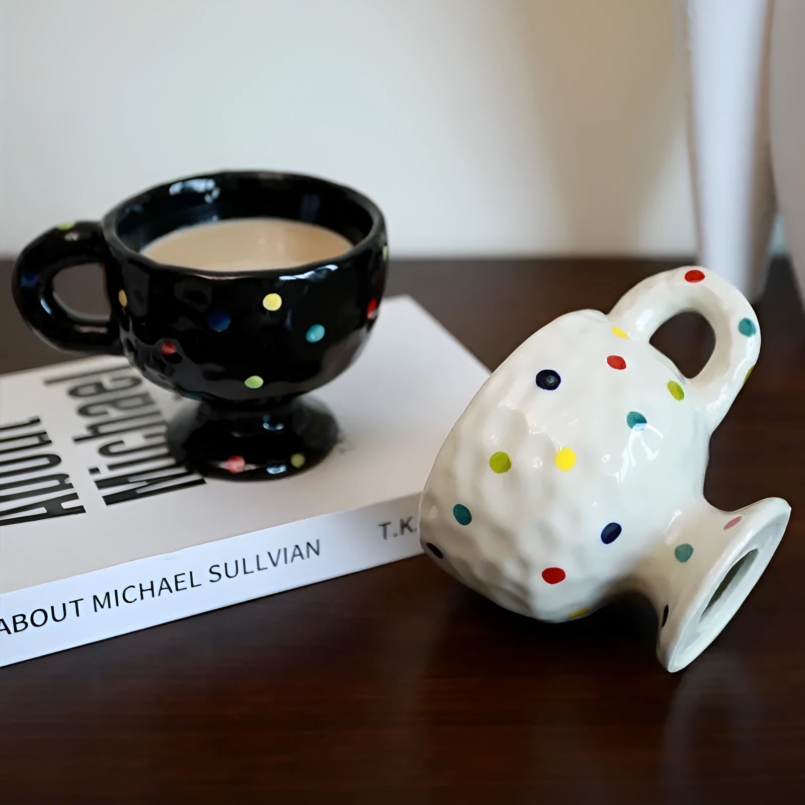 Hand-pinched irregular ceramic mug in a solid colour, showing its unique shape and modern design.