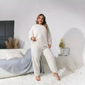Women's milky white plush two-piece pants suit with crew neck top and matching trousers