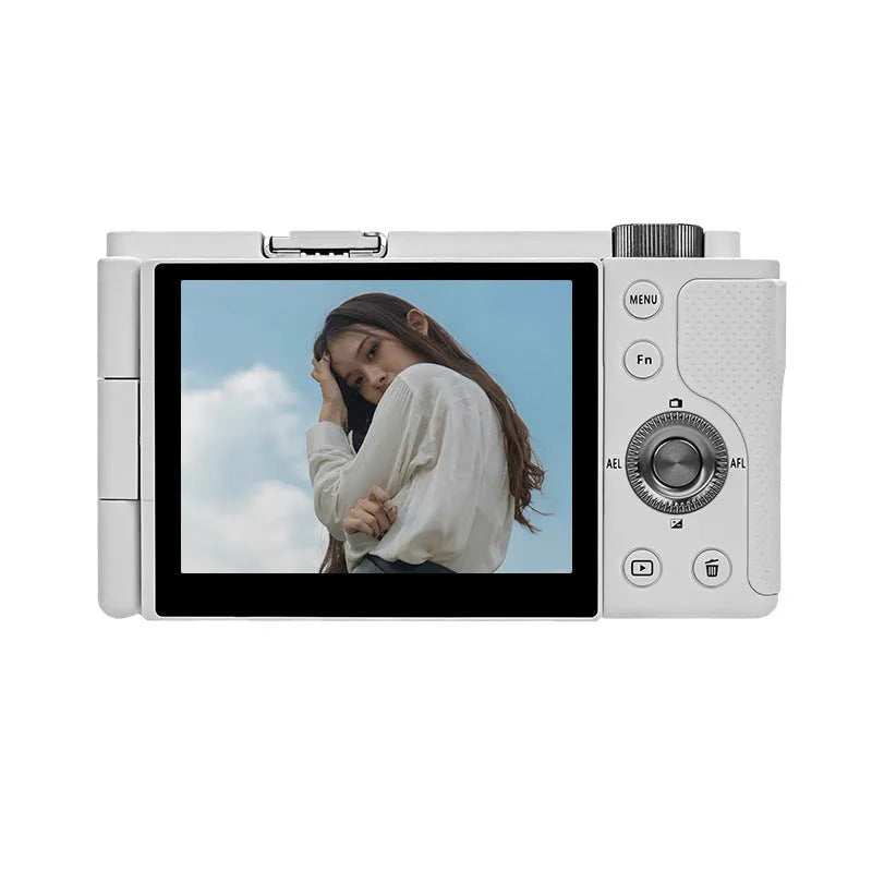 Optical digital micro single camera in black with ultra wide angle lens, touch screen, 117x84x66mm, sling attached, on travel background
