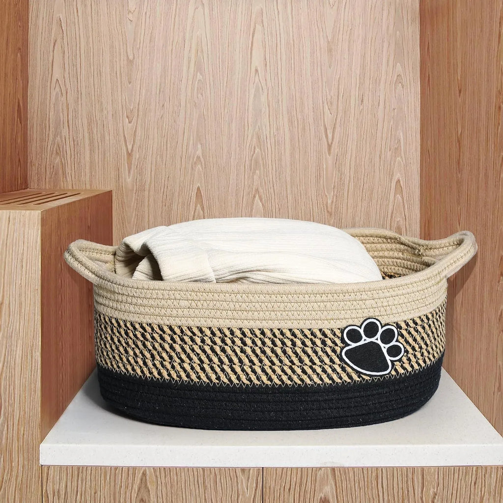 Handmade light beige woven cotton rope storage basket with a wooden handle
