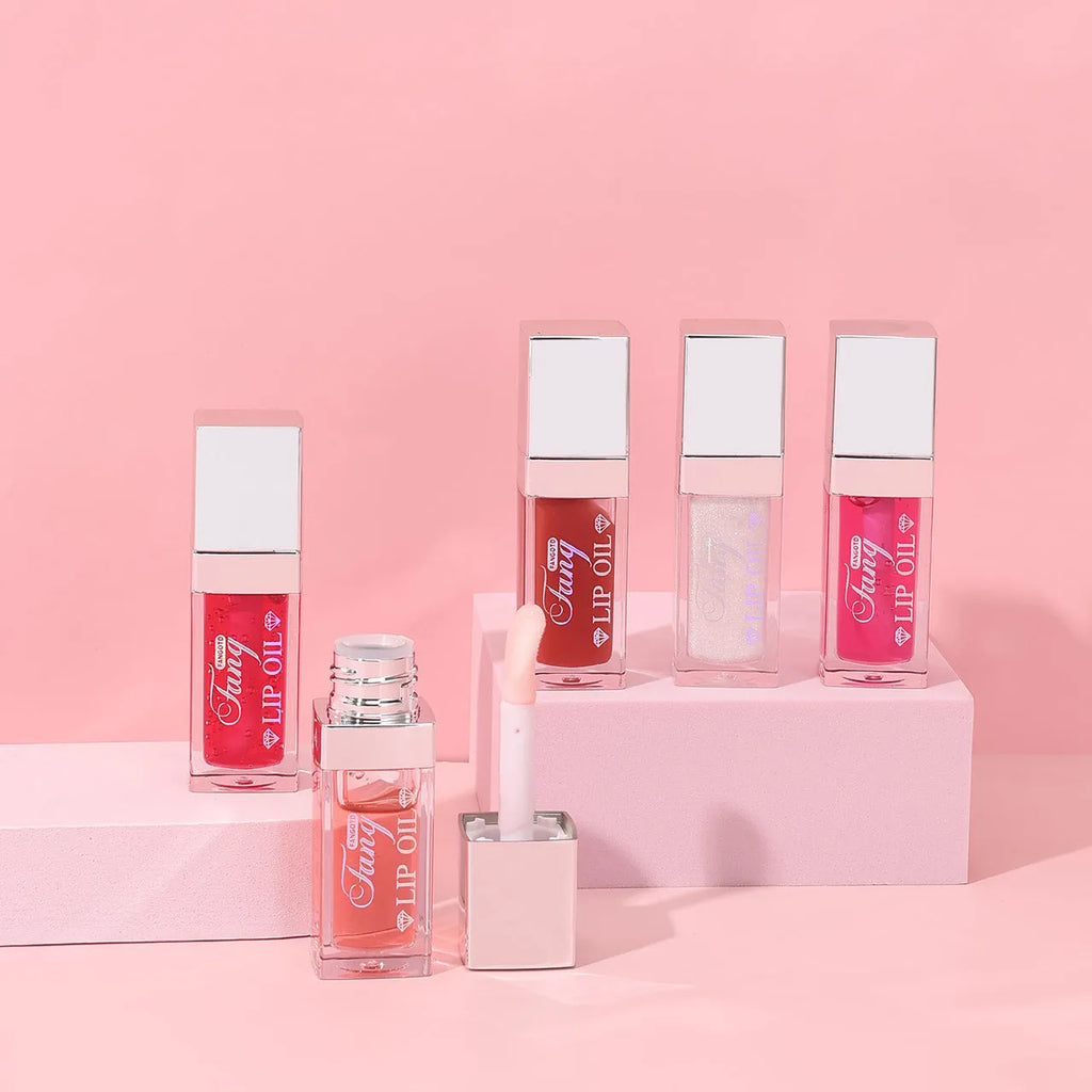 Five colour options of a bright mint lip gloss lipstick with moisturising lip essence oil.