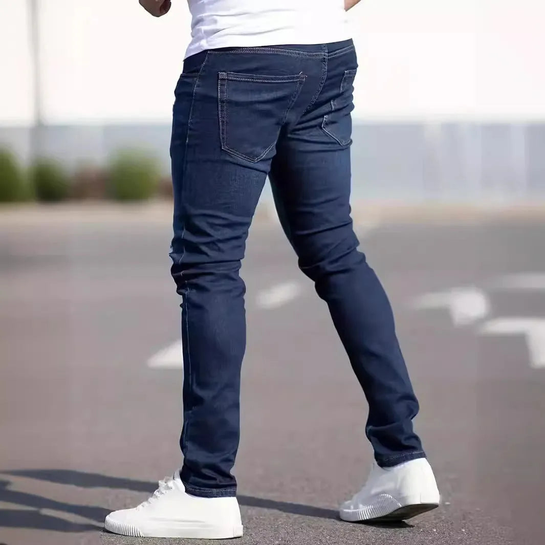 Men's dark blue slim fit casual jeans with skinny leg cut and zipper fly closure