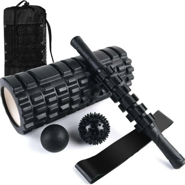 Black handheld foam massage roller bar with six white textured gear pieces on a 33cm shaft.