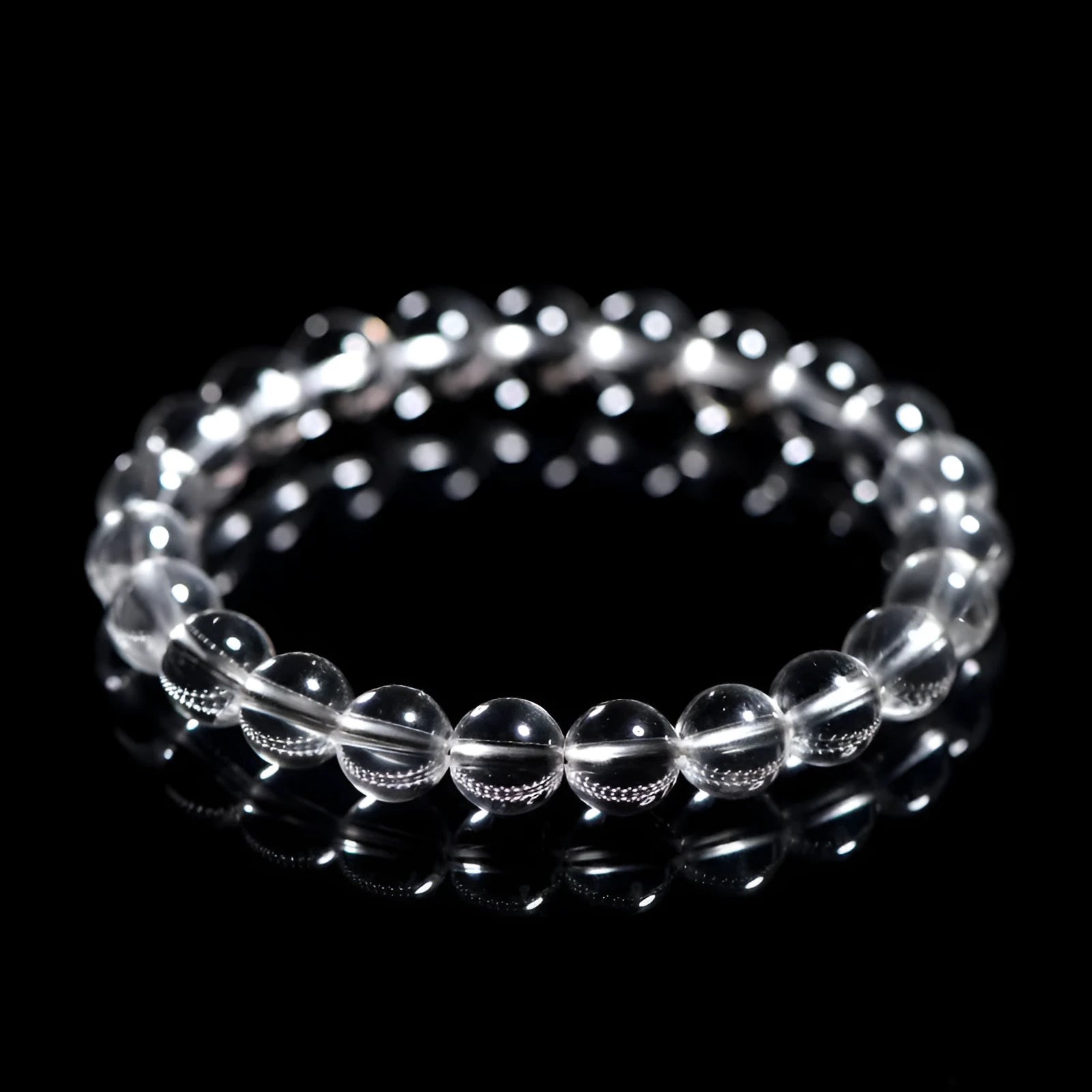 Natural Donghai white water round crystal bead bracelet on a wrist, showing geometric style.