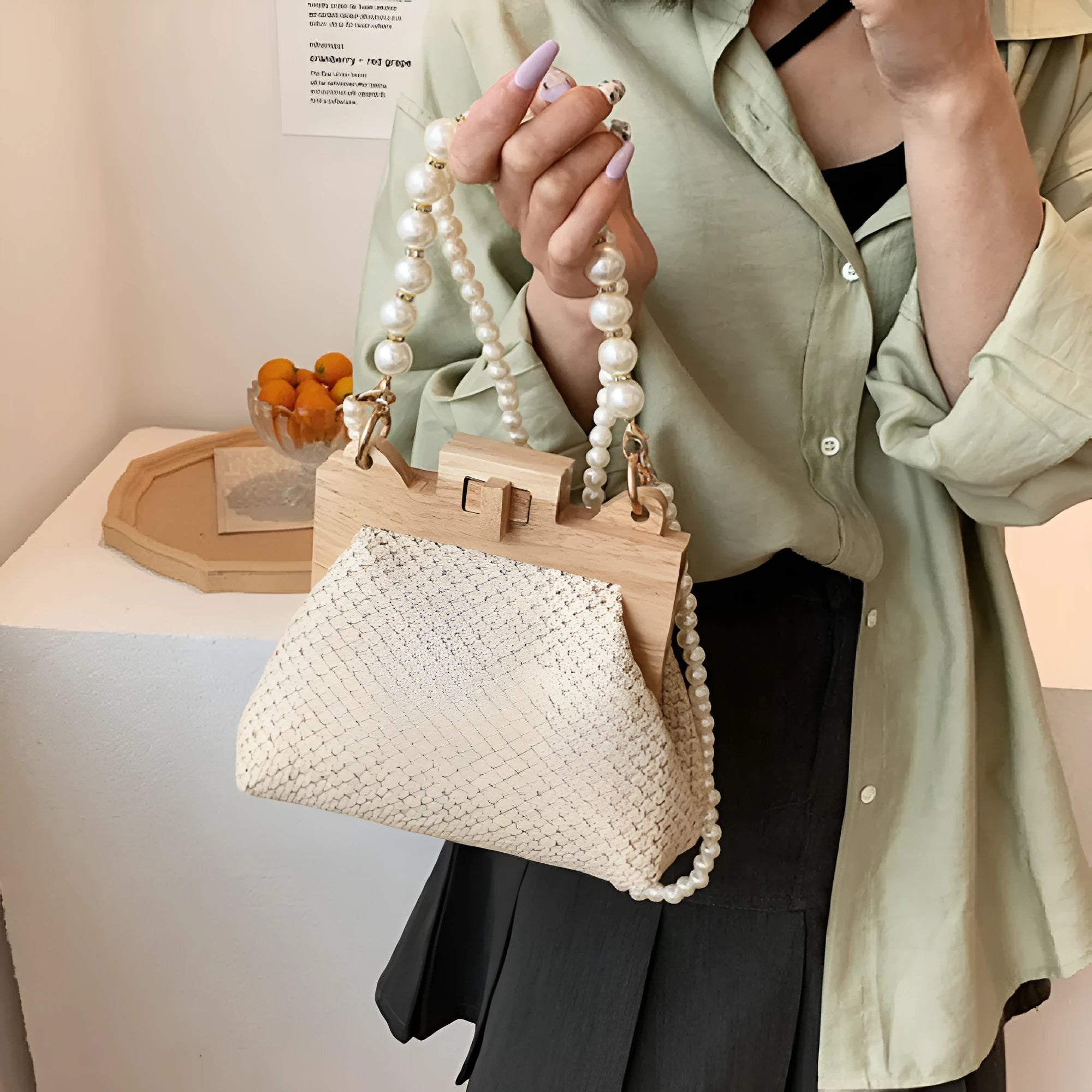Women's straw woven shoulder bag with pearl chain strap in horizontal square shape