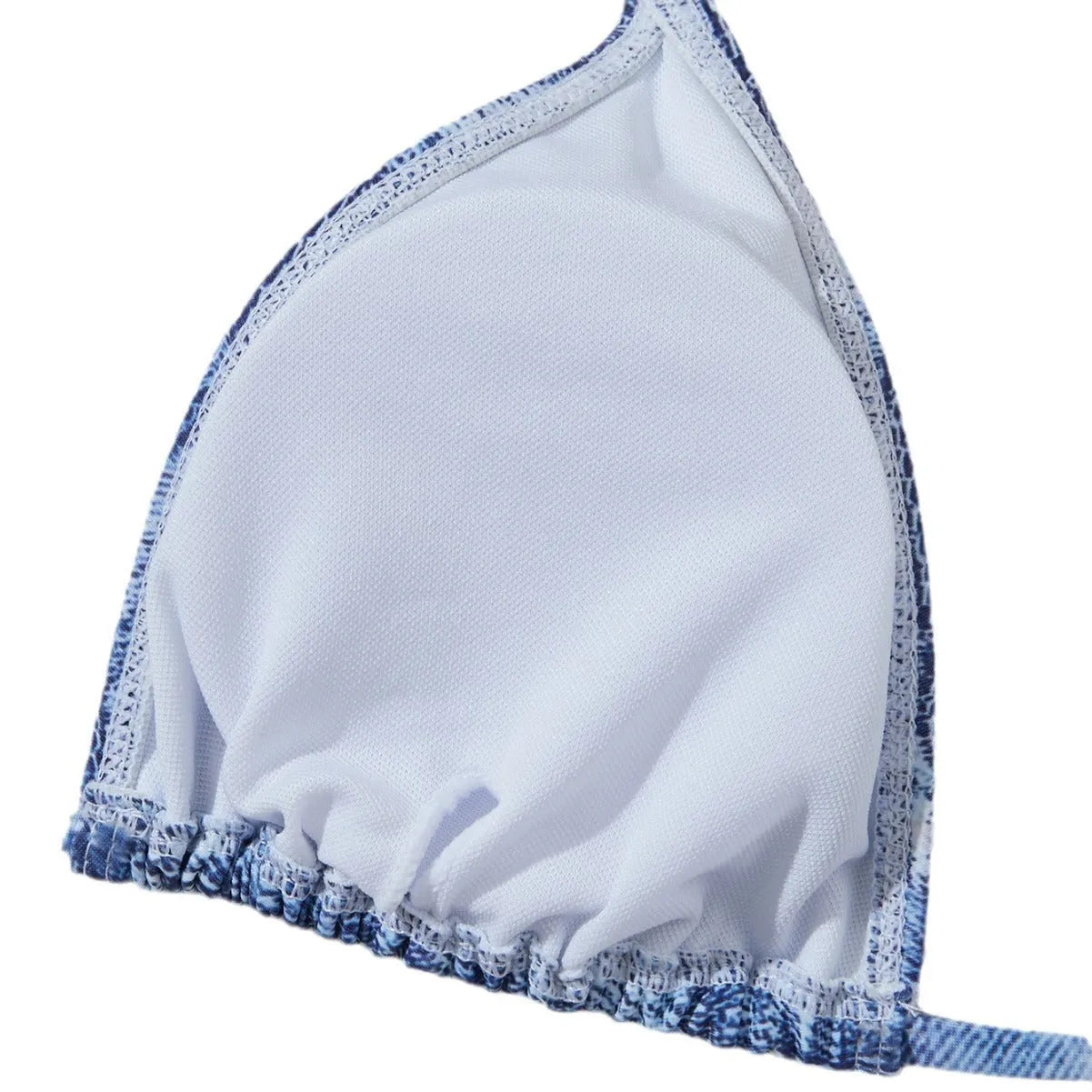 Women's denim blue printed bikini set with halterneck top and side-tie bottoms on a mannequin.