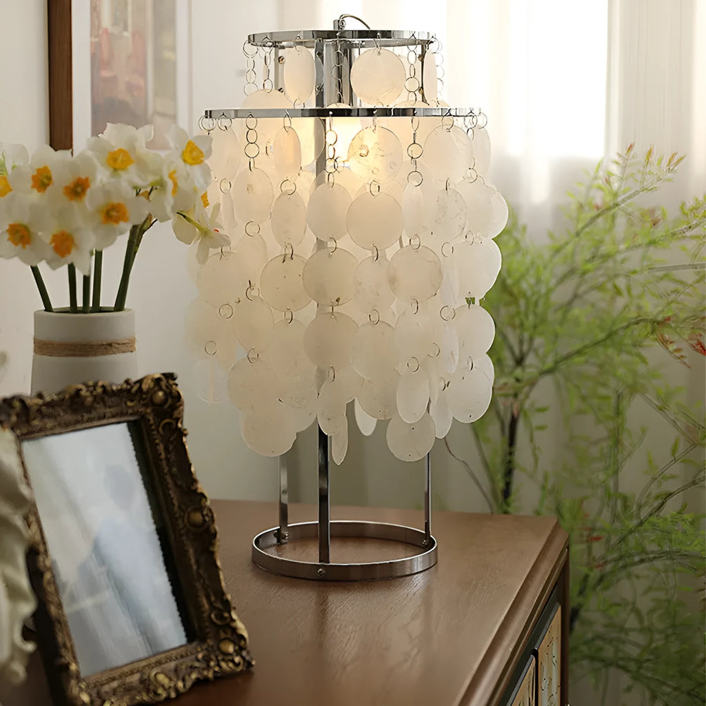 Shell-shaped bedside table lamp with modern design in chrome or gold finish