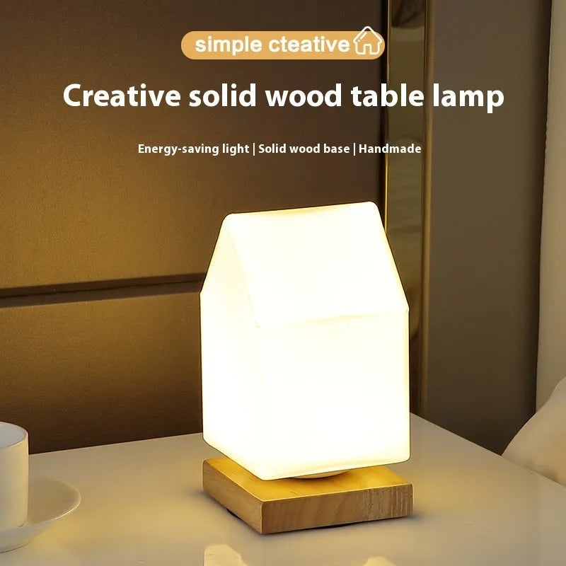 Nordic solid wood USB table lamp with touch dimming in cube style on bedside table