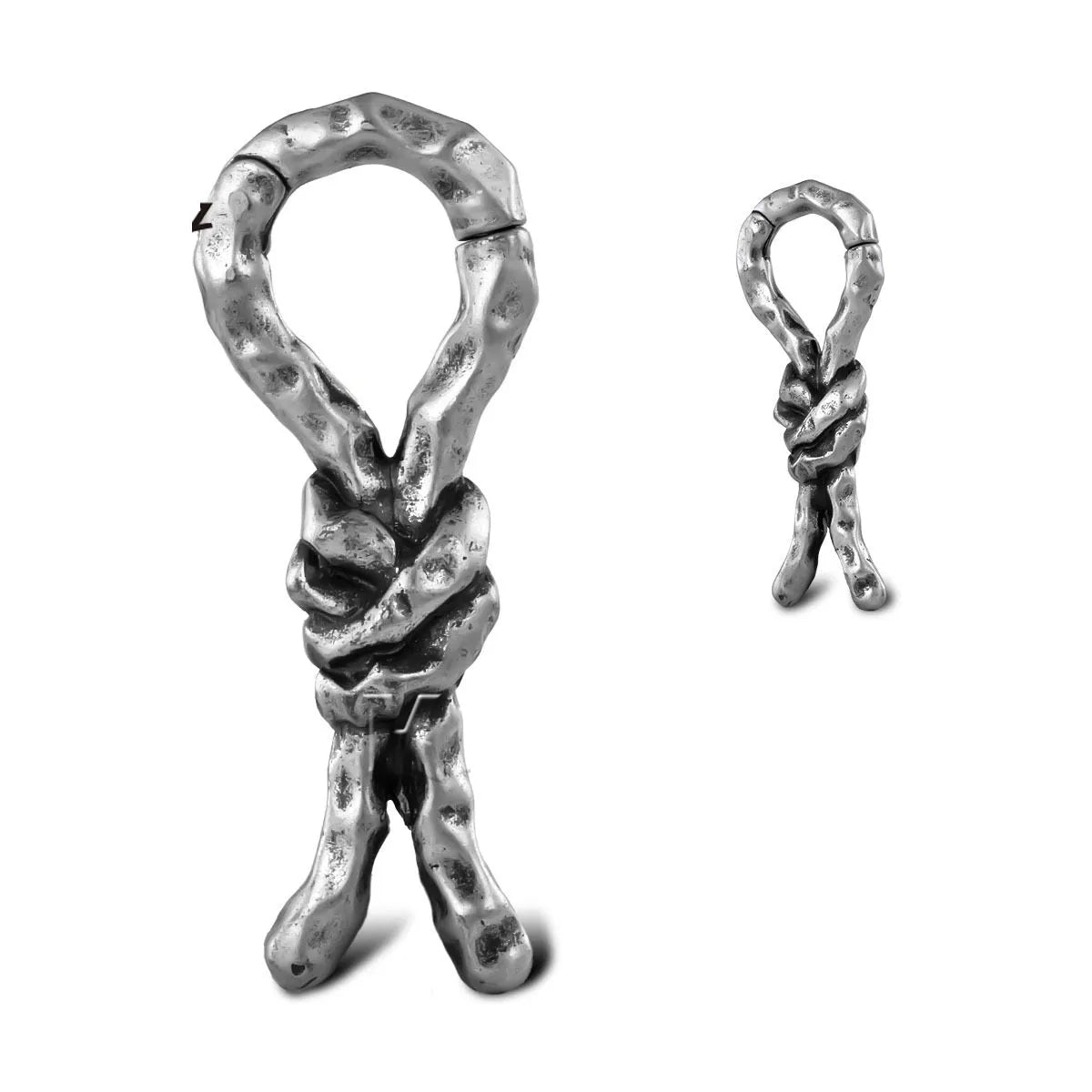 Close-up of copper earrings with a 4mm gauge featuring intricate bends and hitches design