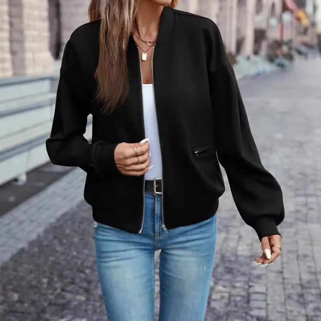 Women's black zip jacket with long sleeves and faux pocket design