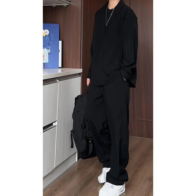 Man wearing a slim fit apricot coloured long sleeve polo shirt and matching trousers, a casual two-piece hemp suit set.