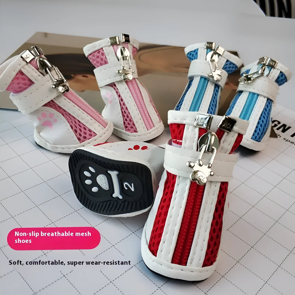 Set of four blue cloth dog shoes with zip closures and non-slip soles for small dogs.