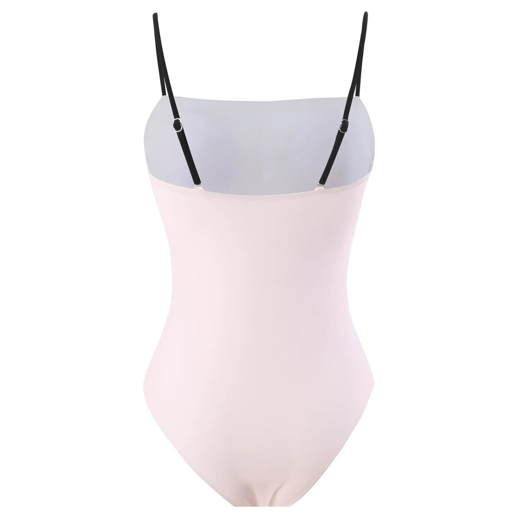 Women's one-piece bikini swimsuit with attached white tulle skirt on a mannequin.