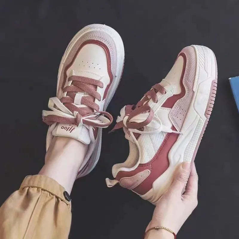 Low top rubber sneakers in pink and milky white with height-increasing design