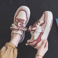 Low top rubber sneakers in pink and milky white with height-increasing design