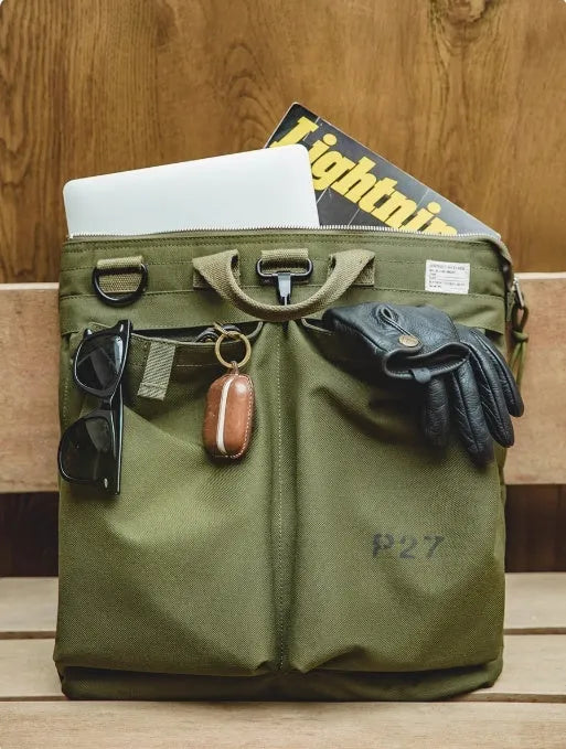 Medium canvas crossbody messenger bag in military green with zipper closure and shoulder strap