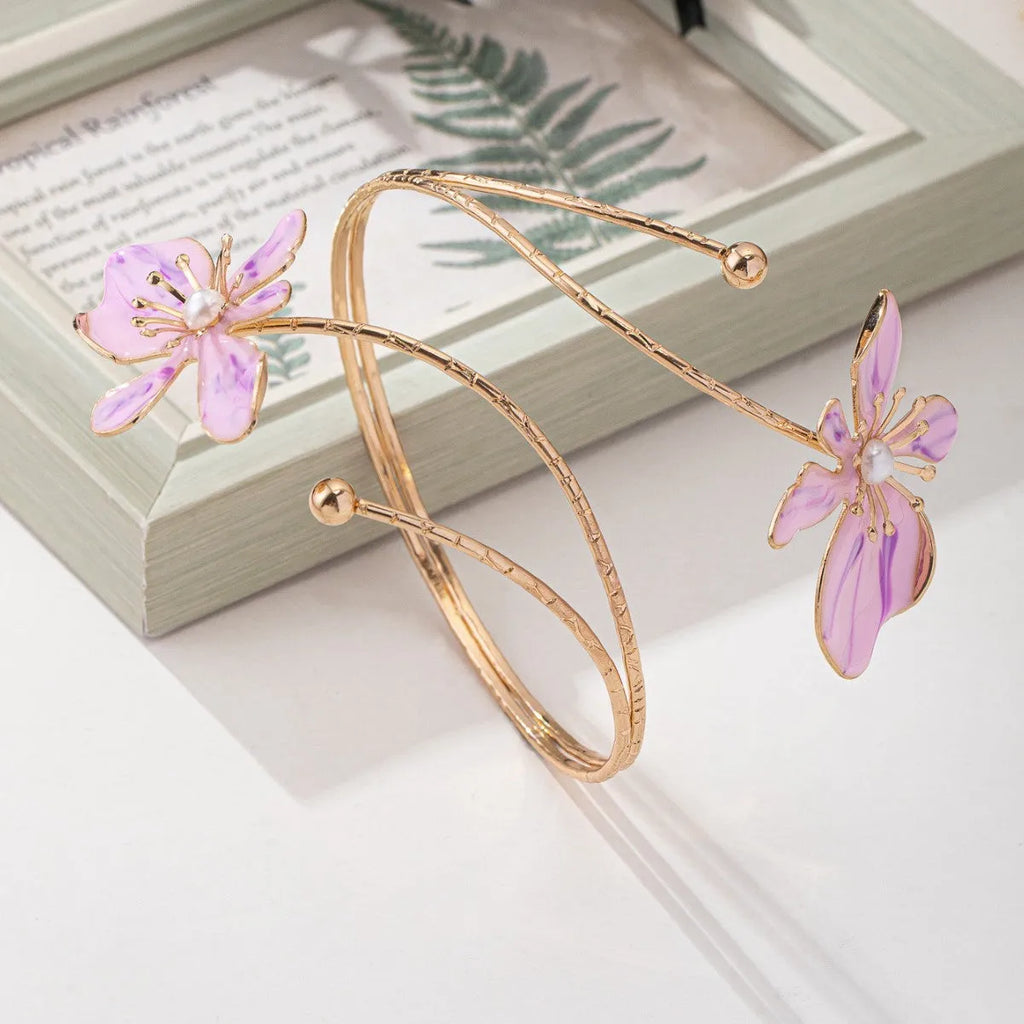 Pink alloy armband with hollow patterned lines design for wrist jewellery