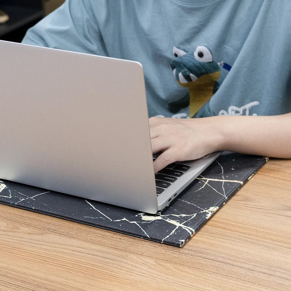 Heat-insulating anti-radiation printing tablet pad for laptops and digital tablets in blue colour on a wooden desk.