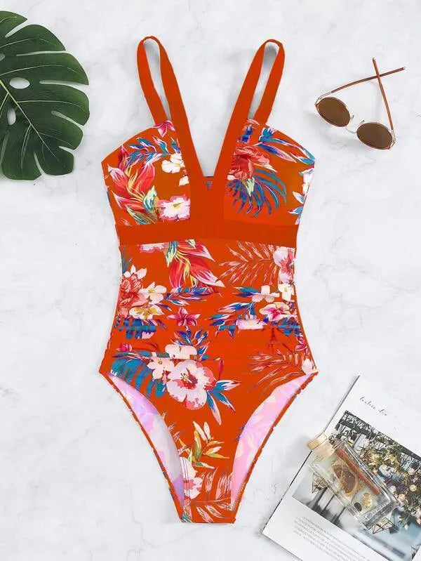 Women's black floral backless one-piece swimsuit on a model, showing spandex lining and high elasticity fit.