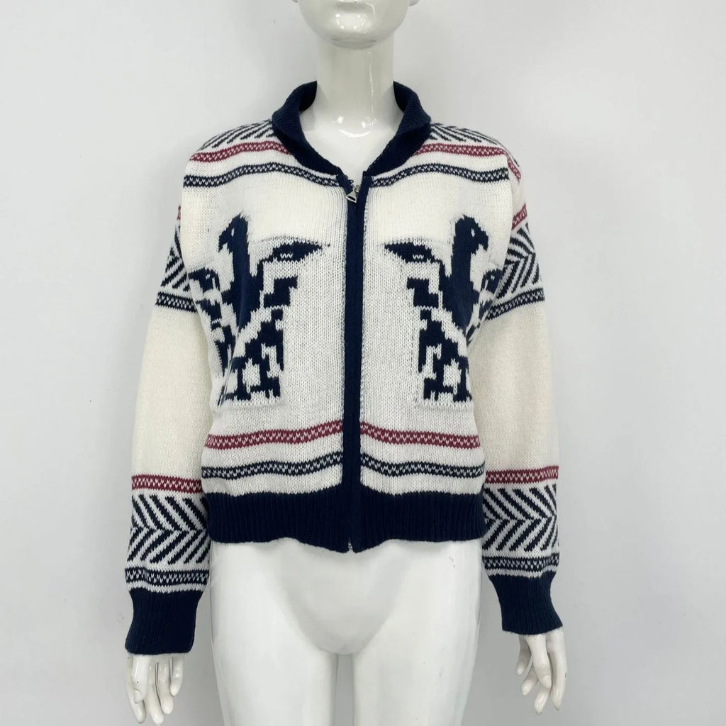 White women's jacquard cardigan with contrast stripes, zipper front, and lapel collar on a hanger.