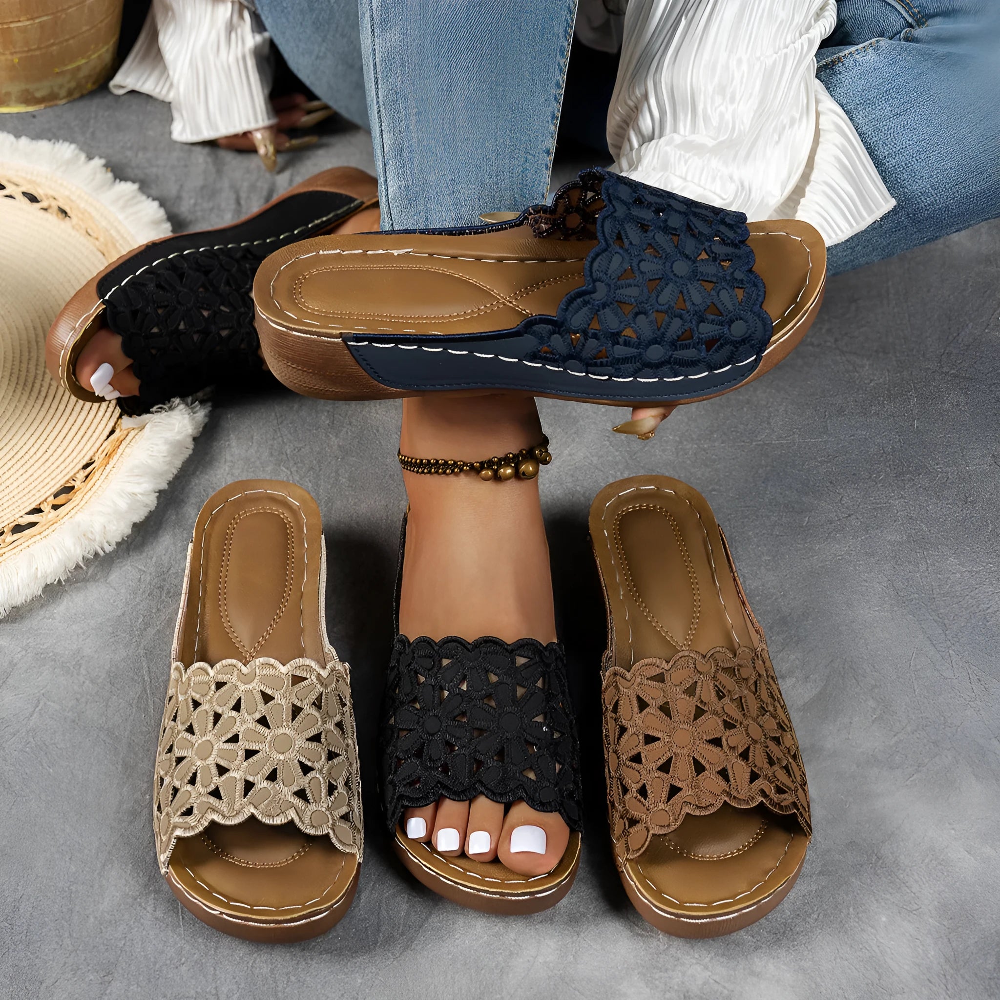 Women's wedge beach slippers with flower cutout design on PVC upper and fish-mouth toe shape.