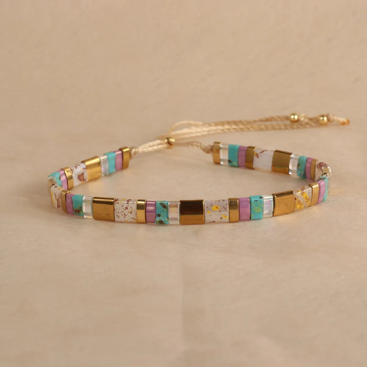 Geometric pull bead glass bracelet in multiple colour options on wrist